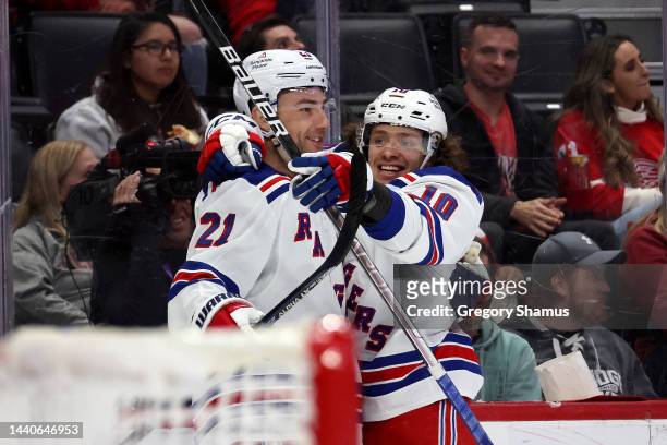 Barclay Goodrow of the New York Rangers celebrates his third period goal with Artemi Panarin while playing the Detroit Red Wings at Little Caesars...
