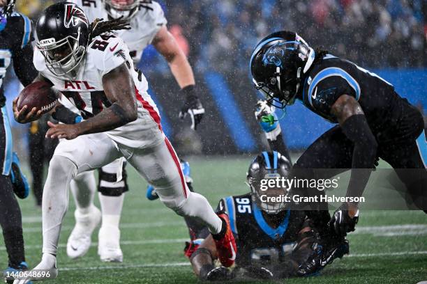 Cordarrelle Patterson of the Atlanta Falcons loses his shoe while running the ball past Jaycee Horn of the Carolina Panthers during the third quarter...