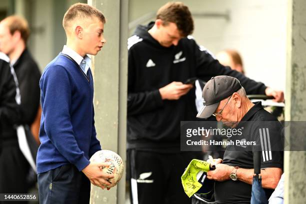 Retiring coach Sir Graham Henry signs autographs for a fan during a New Zealand Black Ferns Rugby World Cup squad captain's run at Gribblehirst Park...