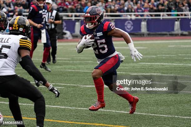 Walter Fletcher of the Montreal Alouettes gains yards after a pass reception against the Hamilton Tiger-Cats at Percival Molson Stadium on November...