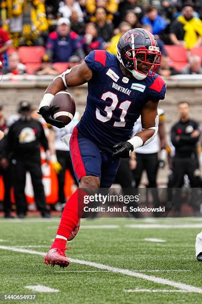 William Stanback of the Montreal Alouettes rushes the football against the Hamilton Tiger-Cats at Percival Molson Stadium on November 6, 2022 in...