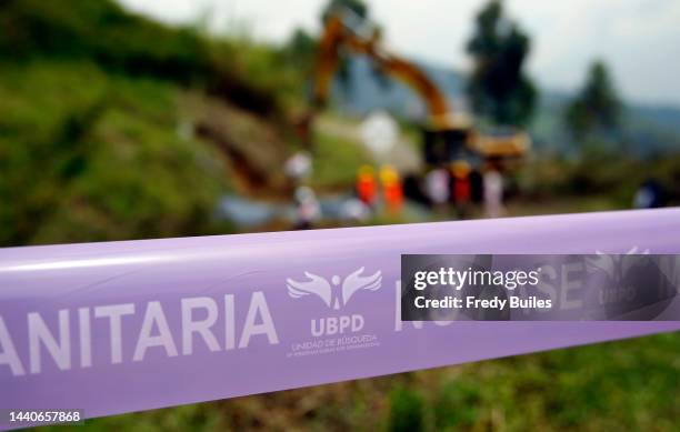 Employees of a missing persons search unit excavate the "La Escombrera" landfill, a construction material dump, during a search for missing people on...