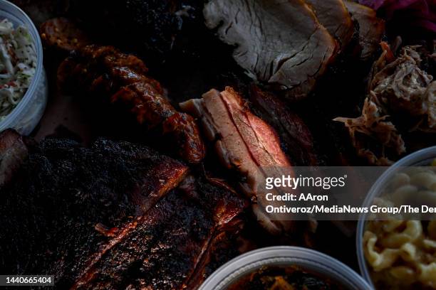 Sampling of meats including ribs, brisket, hot link, turkey breast, pulled pork, macaroni, coleslaw and greens at Post Oak BBQ in Denver on Thursday,...