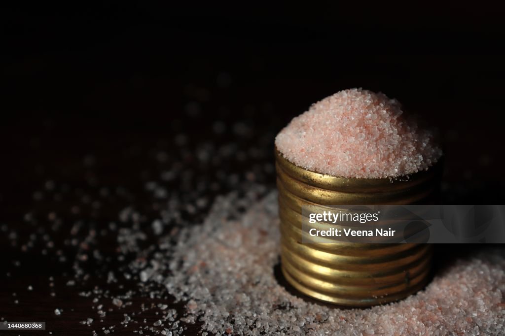 Close-up of Pink salt/Himalayan salt in a brass bowl/Still life