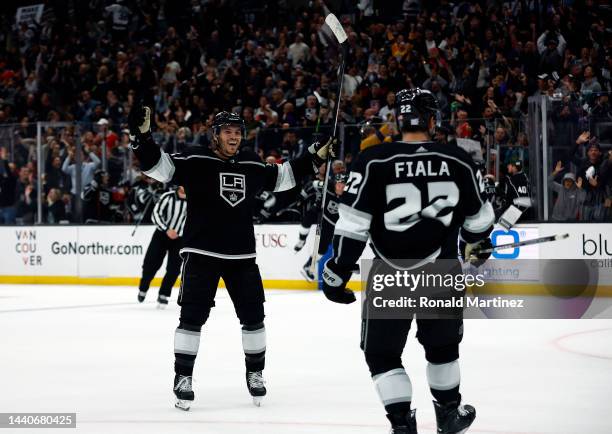 Matt Roy and Kevin Fiala of the Los Angeles Kings celebrate the game winning goal against the Chicago Blackhawks in overtime at Crypto.com Arena on...