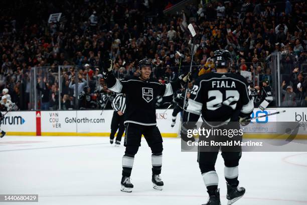 Matt Roy and Kevin Fiala of the Los Angeles Kings celebrate the game winning goal against the Chicago Blackhawks in overtime at Crypto.com Arena on...