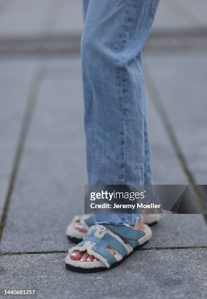 Mandy Bork wearing Agolde blue jeans, Hermes fur baby blue Chypre sandals on November 07, 2022 in Berlin, Germany.