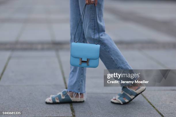 Mandy Bork wearing Agolde blue jeans, Hermes Constance baby blue leather bag, Hermes fur baby blue Chypre sandals on November 07, 2022 in Berlin,...