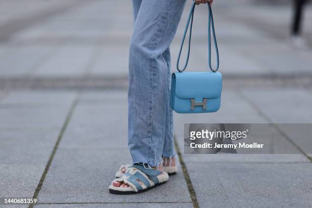 Mandy Bork wearing Agolde blue jeans, Hermes Constance baby blue leather bag, Hermes fur baby blue Chypre sandals on November 07, 2022 in Berlin,...