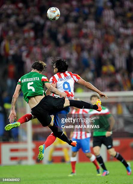 Atletico Madrid's Colombian forward Radamel Falcao vies with Athletic Bilbao's defender Fernando Amorebieta during the UEFA Europa League final...
