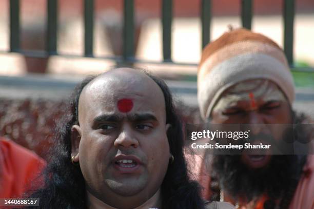 Hindu Sadhus protesting against Communist Party of India - Marxist leader Brinda Karat for raising allegations against Yoga guru Baba Ramdev in New...