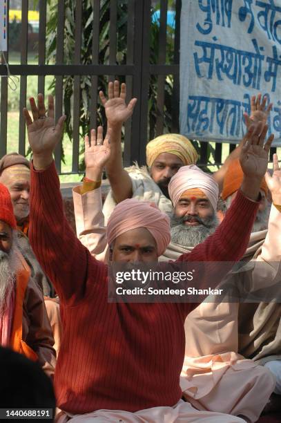 Hindu Sadhus protesting against Communist Party of India - Marxist leader Brinda Karat for raising allegations against Yoga guru Baba Ramdev in New...