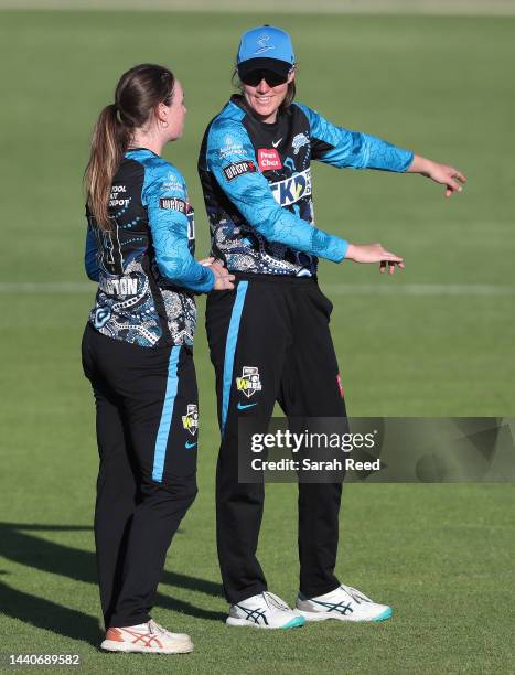 Amanda-Jade Wellington of the Adelaide Strikers and Tahlia McGrath of the Adelaide Strikers discuss tactics during the Women's Big Bash League match...