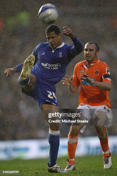 Curtis Davies of Birmingham City clears from Gary Taylor-Fletcher of Blackpool during the npower Championship Playoff Semi Final Second Leg match...
