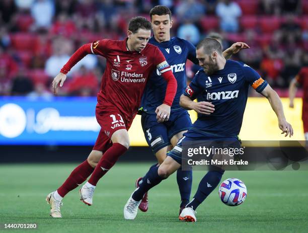 Craig Goodwin of Adelaide United competes with Joshua Brillante of the Victory during the round six A-League Men's match between Adelaide United and...