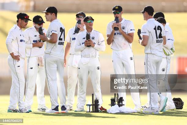 Western Australia players take drinks during the Sheffield Shield match between Western Australia and South Australia at the WACA, on November 11 in...