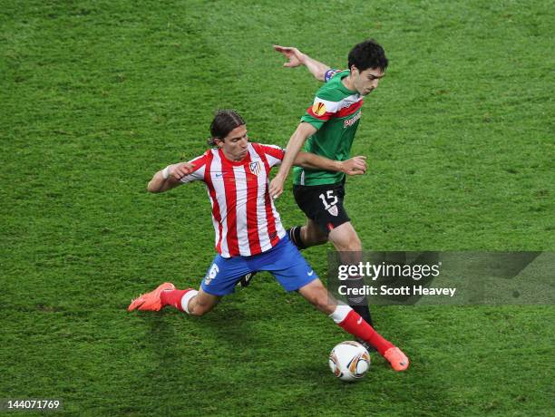 Filipe Luis of Atletico Madrid challenges Andoni Iraola of Athletic Bilbao during the UEFA Europa League Final between Atletico Madrid and Athletic...