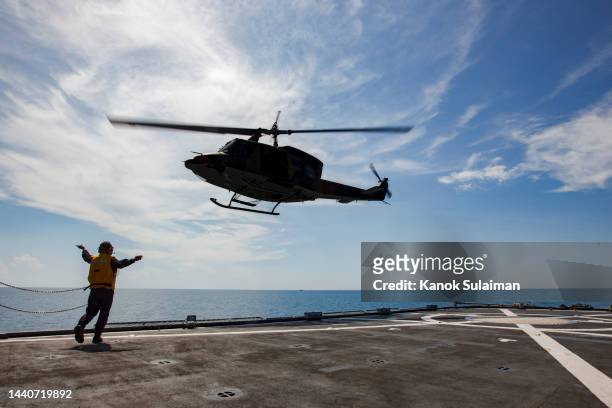 navy helicopters landing - warship stock-fotos und bilder