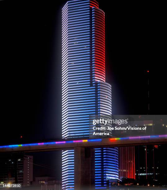 Miami skyline by night, Centrust Building and Metro Rail, Miami, Florida