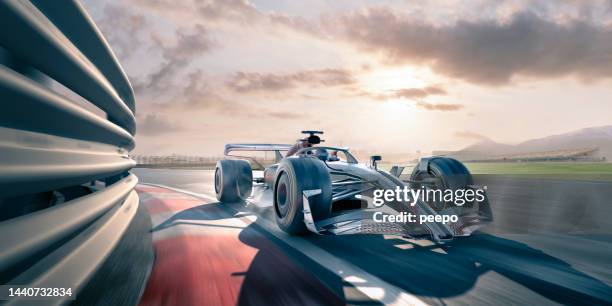 racing car moving around corner on racetrack - stroomlijnen stockfoto's en -beelden