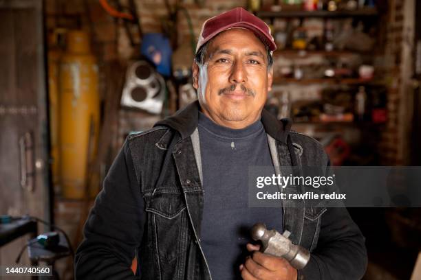 a friendly looking tradesman - tradesman real people man stock pictures, royalty-free photos & images