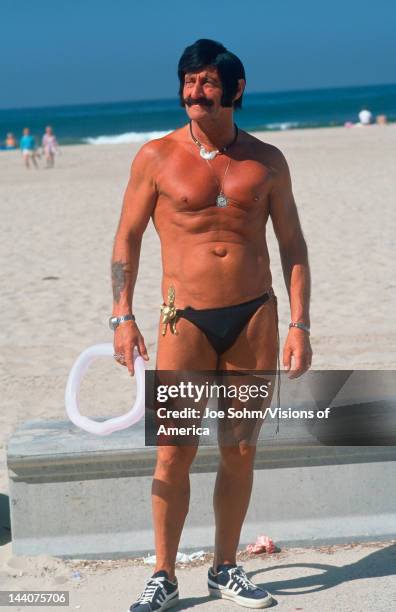 An eccentric senior citizen in a swimming suit, Venice Beach, CA