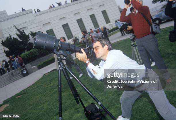 Amateur astronomers using a telescope at Griffith Park Observatory, Los Angeles, CA
