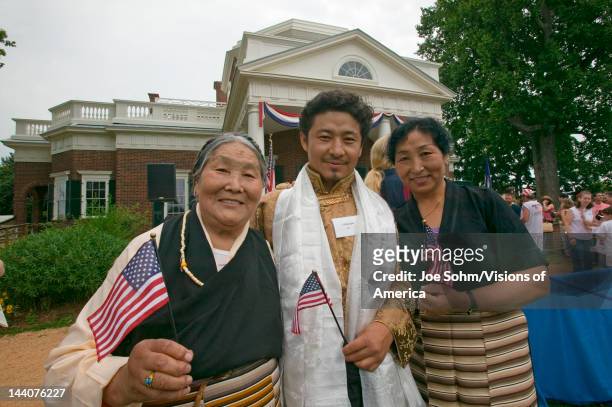 Tibetan immigrant and family and 76 new American citizens at Independence Day Naturalization Ceremony on July 4, 2005 at Thomas Jefferson's home,...