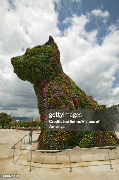 Jeff Koons' living plant sculptor of dog in front of the Guggenheim Museum of Contemporary Art of Bilbao , located on the North Coast of Spain in the...