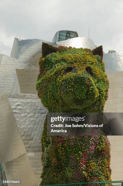Jeffrey Koons' living plant sculptor of dog in front of the Guggenheim Museum of Contemporary Art of Bilbao , located on the North Coast of Spain in...