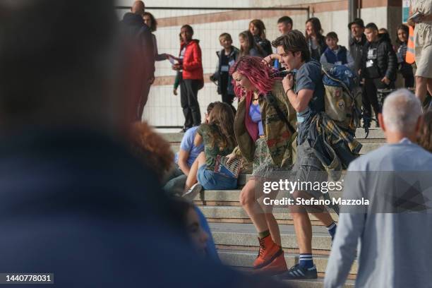 British actress Liv Hill and British actor Louis Partridge walk at Venice train station during filming for an Apple Tv production scheduled to air in...