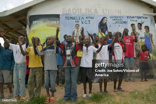 Group of HIV/AIDS infected children sing song about AIDS at the Pepo La Tumaini Jangwani, HIV/AIDS Community Rehabilitation Program, Orphanage &...