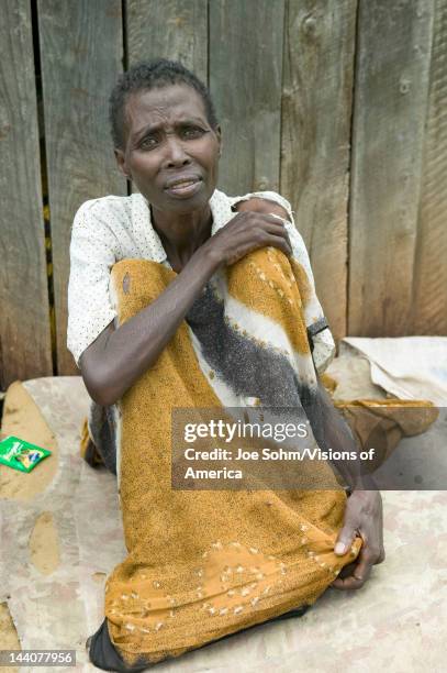 Irene, infected with HIV/AIDS, sits on ground at the Pepo La Tumaini Jangwani, HIV/AIDS Community Rehabilitation Program, Orphanage & Clinic, Pepo La...