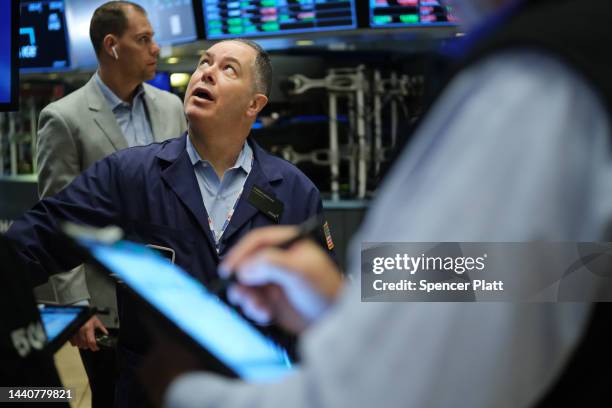 Traders work on the floor of the New York Stock Exchange on November 11, 2022 in New York City. Stocks were mixed in morning trading after surging...