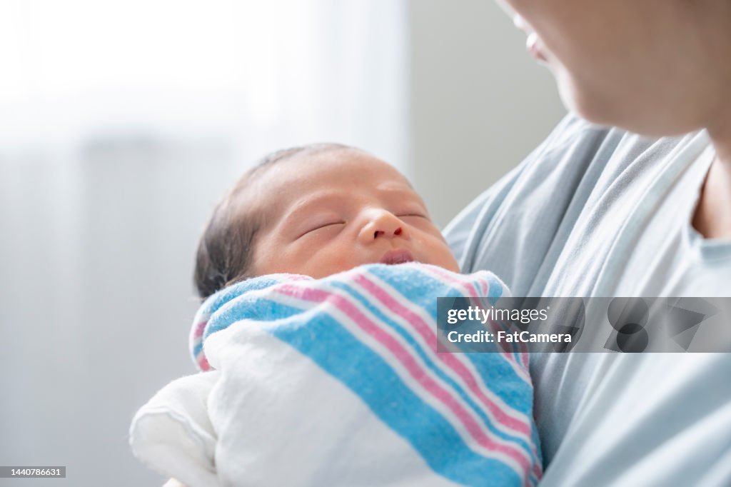 Newborn in Mothers Arms