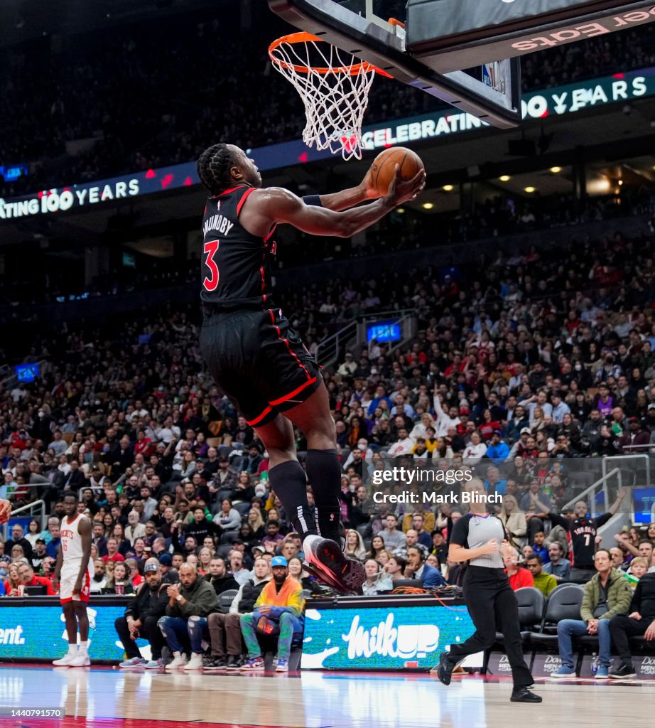 Houston Rockets Toronto Raptors O.G. Anunoby of the Toronto Raptors goes up for a slam dunk against ...