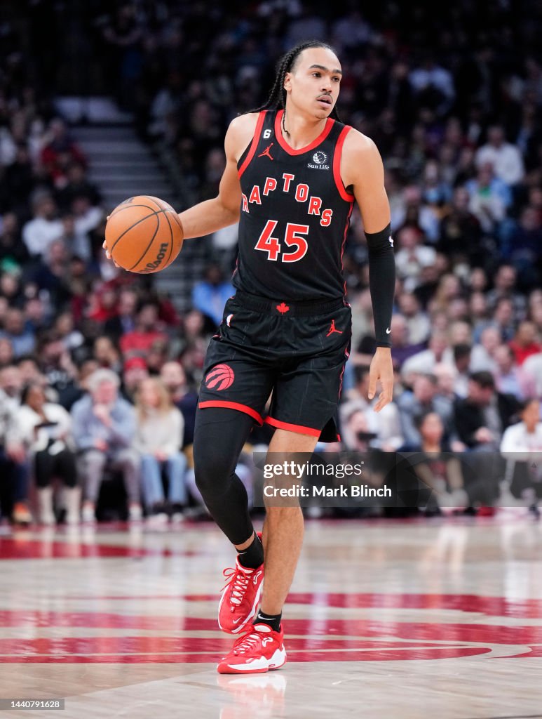 Houston Rockets Toronto Raptors Dalano Banton of the Toronto Raptors dribbles against the Houston ...