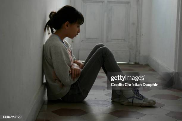 sad and lonely mixed-race teenager. - sitting on ground stock pictures, royalty-free photos & images