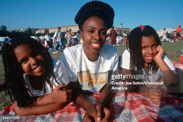African American woman and twin daughters at family reunion, Washington DC