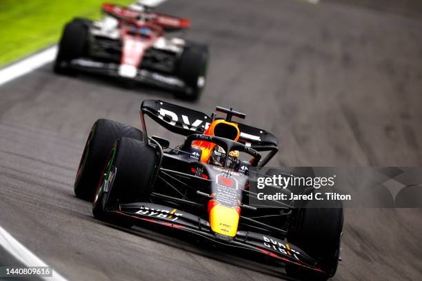 Max Verstappen of the Netherlands driving the Oracle Red Bull Racing RB18 leads Valtteri Bottas of Finland driving the Alfa Romeo F1 C42 Ferrari...