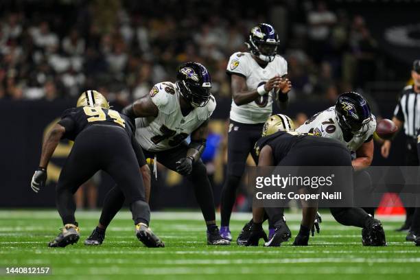 Morgan Moses of the Baltimore Ravens and Kevin Zeitler defend against the New Orleans Saints at Caesars Superdome on November 7, 2022 in New Orleans,...