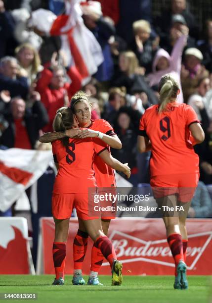 Rachel Daly of England celebrates scoring their team's first goal with teammates Georgia Stanway and Alessia Russo during the International Friendly...