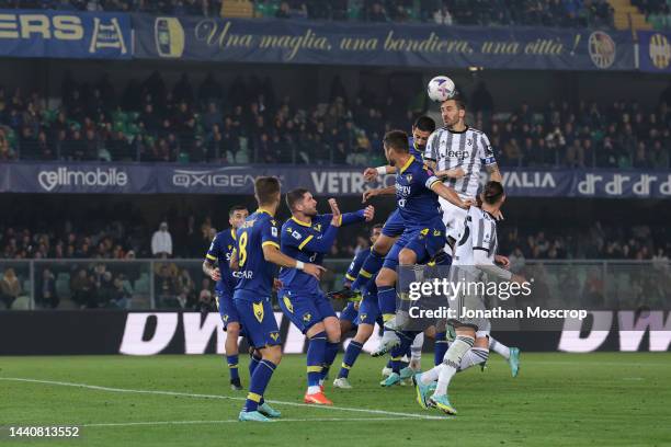 Leonardo Bonucci of Juventus cloimbs above the Hellas Verona defence to head the ball on during the Serie A match between Hellas Verona and Juventus...