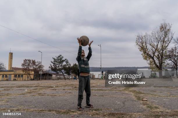 Refugee child plays with a ball in the transition camp of Harmanli on November 11, 2022 in Harmanli, Bulgaria. Harmanli, some 45 kilometers from the...