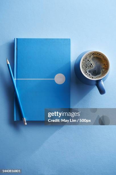 blank blue notepad and cup of coffee,malaysia - blue note pad stock pictures, royalty-free photos & images