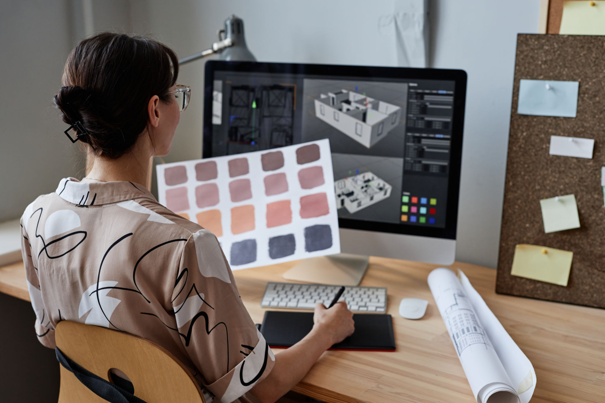 Female designer holding color swatches Female designer holding color swatches