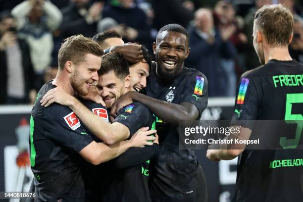 Ramy Bensebaini of Borussia Monchengladbach celebrates with teammates after scoring their side's second goal during the Bundesliga match between...