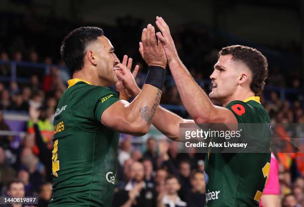 Valentine Holmes of Australia celebrates their sides second try with team mates Nathan Cleary during the Rugby League World Cup Semi-Final match...