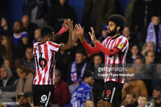 Ellis Simms of Sunderland celebrates with teammate Amad Diallo after scoring their side's first goal during the Sky Bet Championship between...