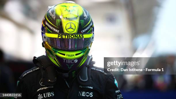 Eighth placed qualifier Lewis Hamilton of Great Britain and Mercedes looks on in parc ferme during qualifying ahead of the F1 Grand Prix of Brazil at...